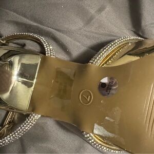 Gorgeous gold heels with rhinestone bow accent